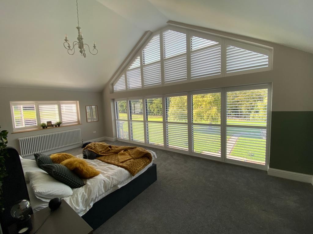 Shutters, vaulted bedroom