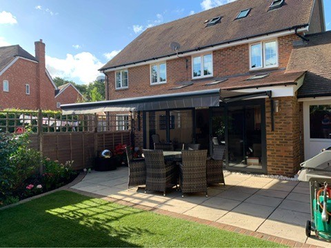 Patio awning over a garden seating area
