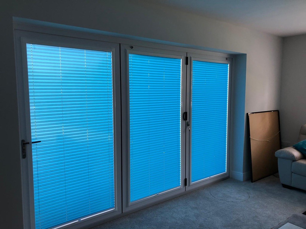 Venetian blinds fitted across patio doors